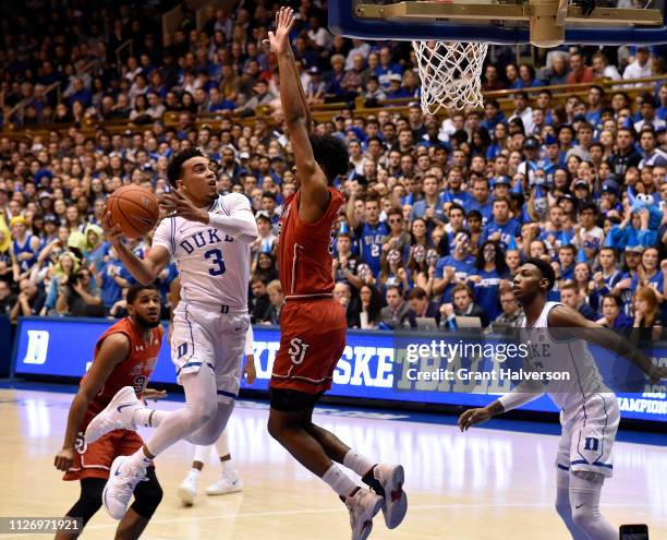 Tre Jones of the Duke Blue Devils drives against Justin Simon of the St. John's Red Storm during the second half of their game at Cameron Indoor...