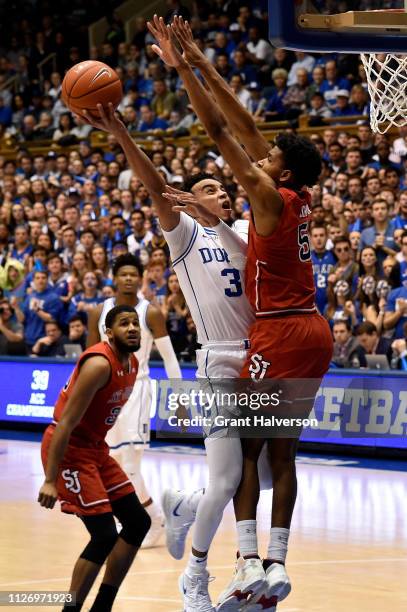 Tre Jones of the Duke Blue Devils drives against Justin Simon of the St. John's Red Storm during the second half of their game at Cameron Indoor...