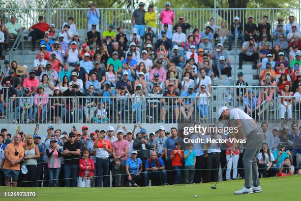 Dustin Johnson of the United States hits a putt on the 18th hole during the first round of World Golf Championships-Mexico Championship at Club de...