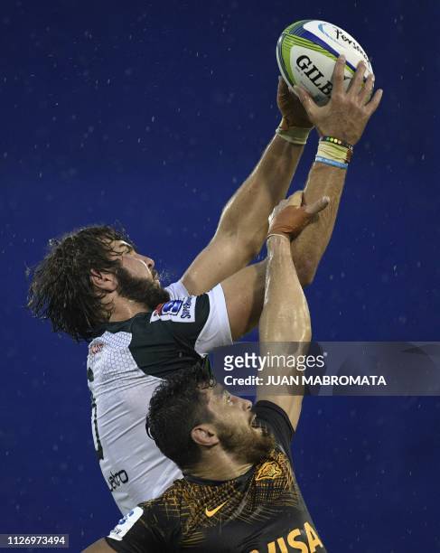 South Africa's Bulls lock Lood De Jager reaches for the lineout ball against Argentina's Jaguares N8 Javier Ortega during their Super Rugby match at...