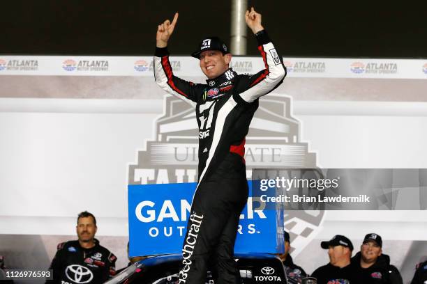 Kyle Busch, driver of the Cessna Toyota, celebrates in victory lane after winning the NASCAR Gander Outdoors Truck Series Ultimate Tailgating 200 at...