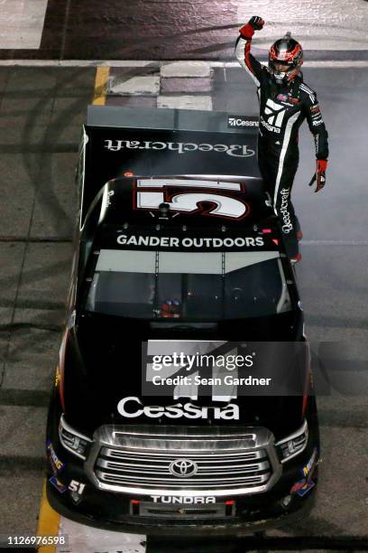 Kyle Busch, driver of the Cessna Toyota, celebrates after winning the NASCAR Gander Outdoors Truck Series Ultimate Tailgating 200 at Atlanta Motor...