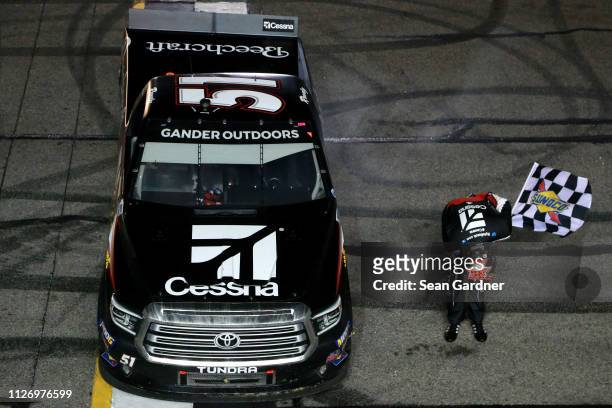 Kyle Busch, driver of the Cessna Toyota, celebrates after winning the NASCAR Gander Outdoors Truck Series Ultimate Tailgating 200 at Atlanta Motor...