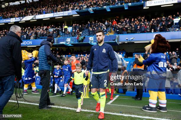 Huddersfield Town captain Tommy Smith leads out his team before the Premier League match between Chelsea FC and Huddersfield Town at Stamford Bridge...