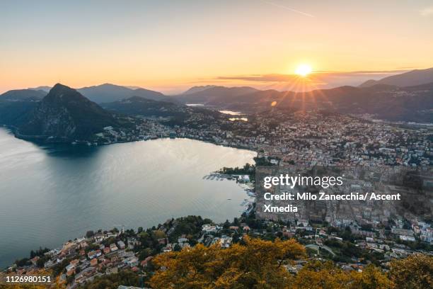 elevated view of lugano and lake lugano at dusk - ticino canton stock pictures, royalty-free photos & images