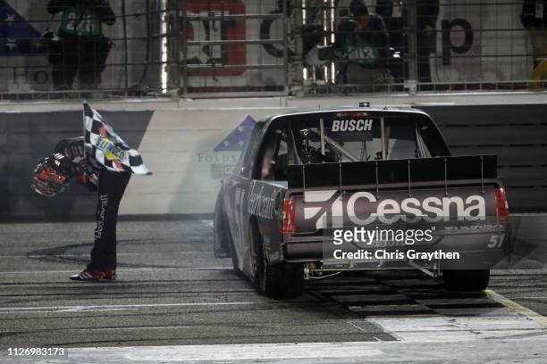 Kyle Busch, driver of the Cessna Toyota, celebrates after winning the NASCAR Gander Outdoors Truck Series Ultimate Tailgating 200 at Atlanta Motor...