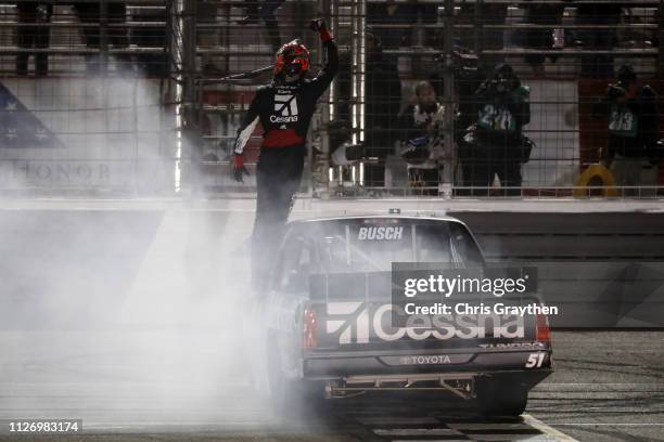 Kyle Busch, driver of the Cessna Toyota, celebrates after winning the NASCAR Gander Outdoors Truck Series Ultimate Tailgating 200 at Atlanta Motor...