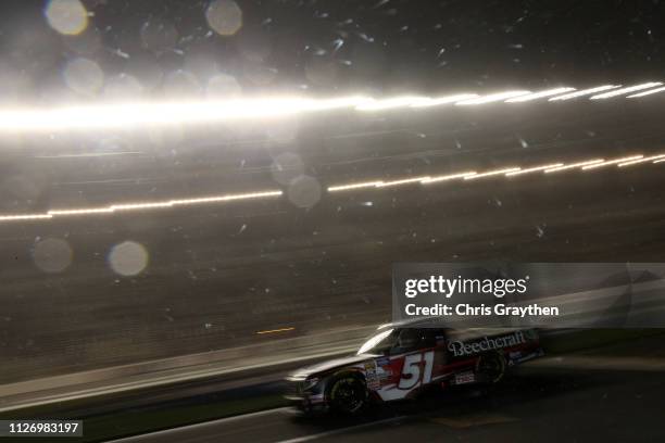 Kyle Busch, driver of the Cessna Toyota, sits on pit road in heavy mist during the NASCAR Gander Outdoors Truck Series Ultimate Tailgating 200 at...