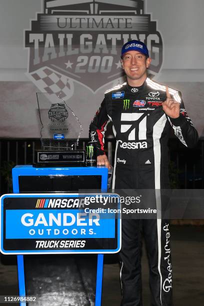 Kyle Busch, KBM Toyota Tundra celebrates winning the 11th running of the Ultimate Tailgating 200 NASCAR Gander Outdoors Truck Series race on February...