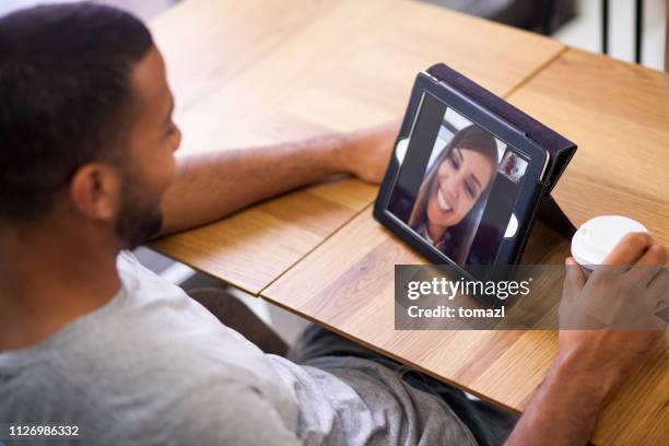 video conference call with the girlfriend - zoom date stock pictures, royalty-free photos & images