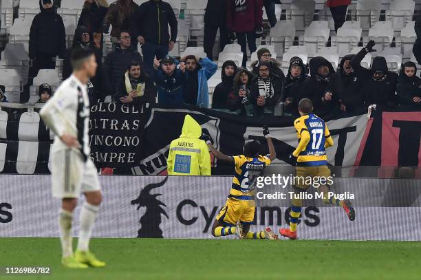 Cristiano Ronaldo of Juventus looks on as Gervinho of Parma celebrates with team mates after scoring the equalizing goal during the Serie A match...