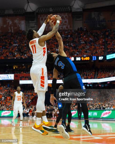 Duke Blue Devils Guard Tre Jones and Syracuse Orange Forward Oshae Brissett compete for a rebound during the first half of the game between the Duke...