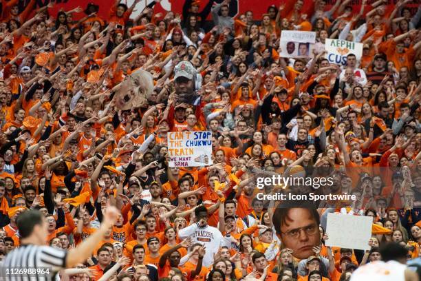 Syracuse Orange fans cheer and hold up signs during the first half of the game between the Duke Blue Devils and the Syracuse Orange on February 23 at...