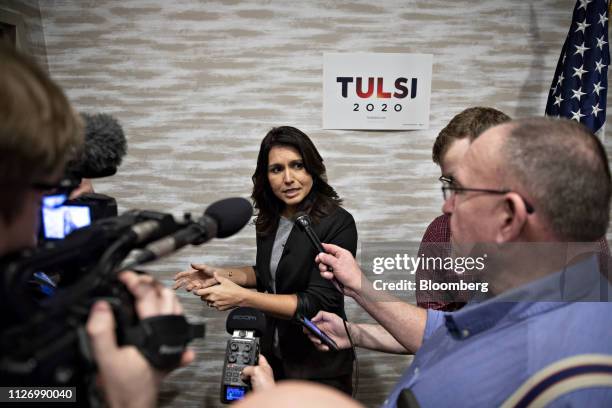 Representative Tulsi Gabbard, a Democrat from Hawaii and 2020 presidential candidate, center, speaks to members of the media during a campaign stop...