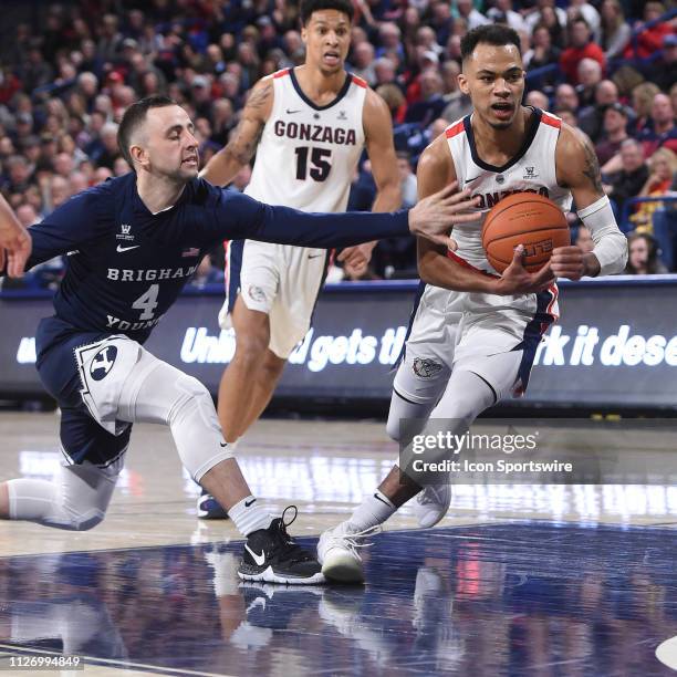 Gonzaga guard Geno Crandall drives to the basket as BYU guard Nick Emery tries to steal the ball during the game between the BYU Cougars and the...