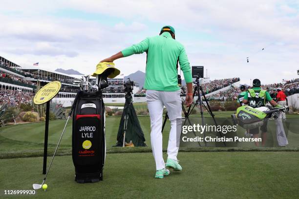 Rickie Fowler touches a temporary memorial to the late PGA pro Jarrod Lyle as he walks up to the 16th tee during the third round of the Waste...