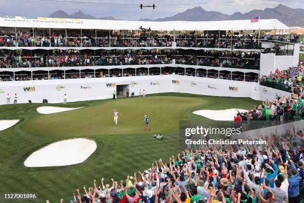 Chris Stroud reacts to a birdie putt on the 16th green during the third round of the Waste Management Phoenix Open on February 02, 2019 in...