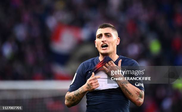 Paris Saint-Germain's Italian midfielder Marco Verratti reacts during the French L1 football match between Paris Saint-Germain and Nimes Olympique at...
