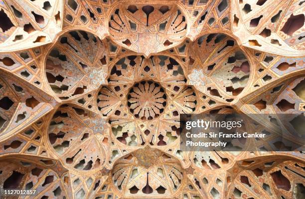 kaleidoscope-like ceiling in ali qapu's palace ("kakh-e ali qapu") with colorful muqarnas in isfahan, iran - amazing architecture bildbanksfoton och bilder