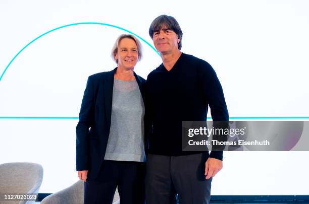 Joachim Loew , head coach of the german national team, and Martina Voss-Tecklenburg , head coach of the german national women team, stay on the stage...