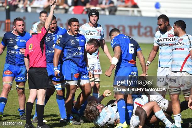 Castres' French prop Wilfrid Hounkpatin celebrates after winning a scrum against Racing's captain and hooker Dimitry Szarzewski during the Top14...