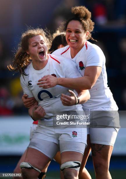 Sarah Beckett of England celebrates after touching down for a try with temmate Shaunagh Brown during the Wales Women and England Women match in the...