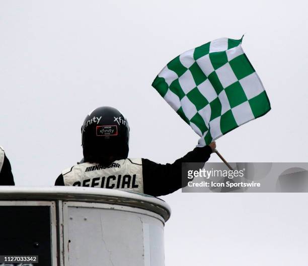 Hampton, GA The Xfinity offical waves the green checkered flag meaning the end of a stage during the running of the Rinnai 250 on February 23,2019 at...