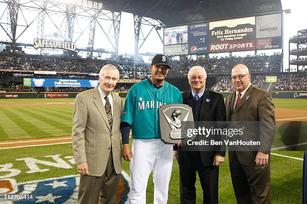 Starting pitcher Felix Hernandez of the Seattle Mariners receives his American League Cy Young Award prior to the Mariners home opener against the...