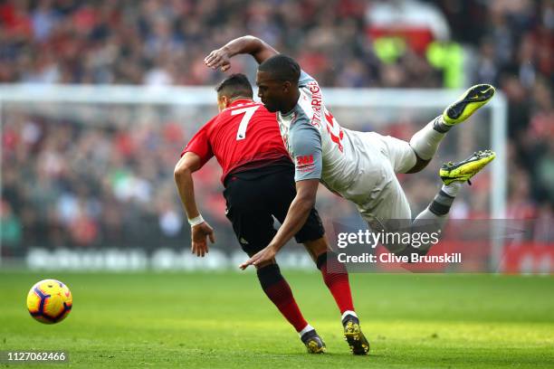 Alexis Sanchez of Manchester United battles for possession with Daniel Sturridge of Liverpool during the Premier League match between Manchester...