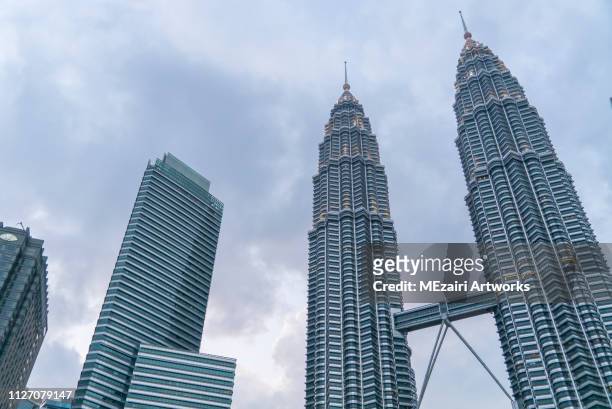 blue hour scene at petronas twin towers klcc - kuala lumpur twin tower stock pictures, royalty-free photos & images