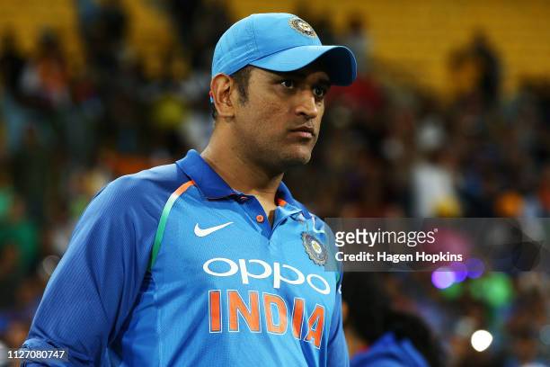 Dhoni of India looks on during game five in the One Day International series between New Zealand and India at Westpac Stadium on February 03, 2019 in...