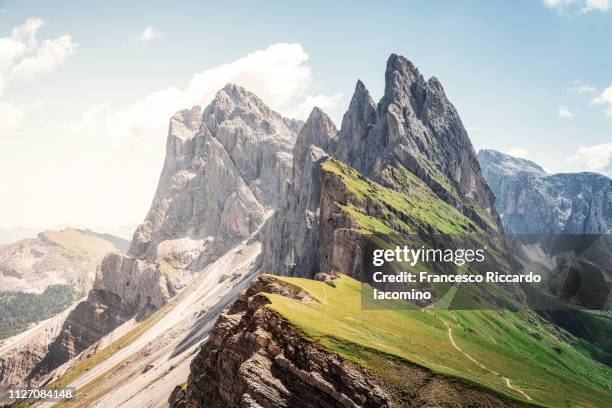 seceda mountain peak with green field - mountain peak path stock pictures, royalty-free photos & images