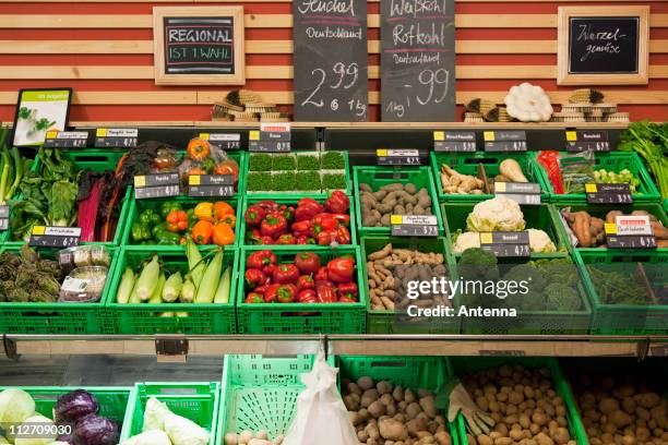 vegetable section of a supermarket - market stall stock pictures, royalty-free photos & images