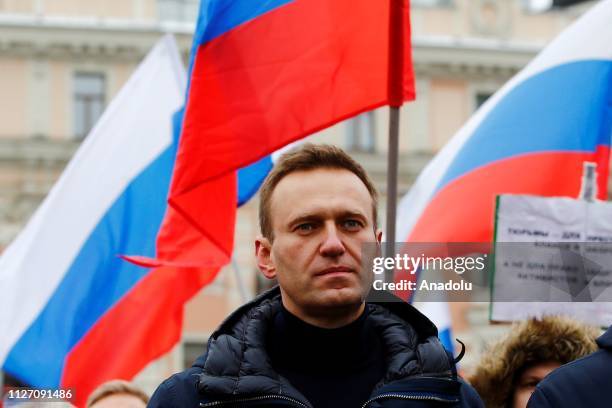 Russian opposition leader Alexei Navalny takes part in a march at Strastnoy Boulevard in memory of Russian politician and opposition leader Boris...