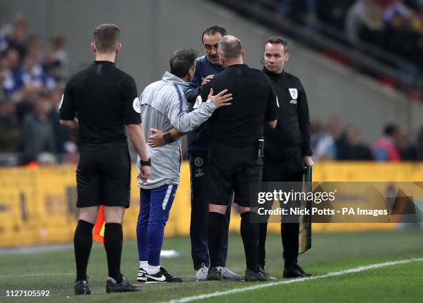 Chelsea manager Maurizio Sarri speaks with referee Jonathan Moss after his first-choice goalkeeper Kepa Arrizabalaga refuses to leave the pitch after...