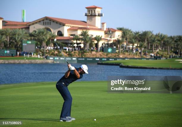 Dustin Johnson of The United States plays his second shot on the 18th hole during Day four of the Saudi International at the Royal Greens Golf &...