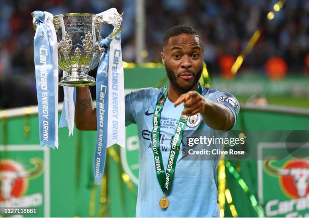 Raheem Sterling of Manchester City celebrates with the trophy after winning the Carabao Cup Final between Chelsea and Manchester City at Wembley...