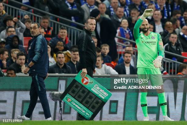 Chelsea's Italian head coach Maurizio Sarri reacts after Chelsea's Spanish goalkeeper Kepa Arrizabalaga remains on the pitch after an attempt to...