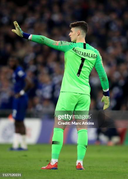 Kepa Arrizabalaga of Chelsea reacts as Maurizio Sarri tries to substitute him during the Carabao Cup Final between Chelsea and Manchester City at...