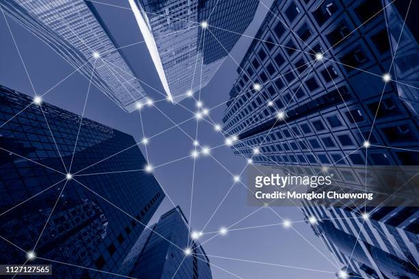 blue tone cityscape of yeouido business district at seoul city in south korea with network connection concept , network in business district - chain technology foto e immagini stock