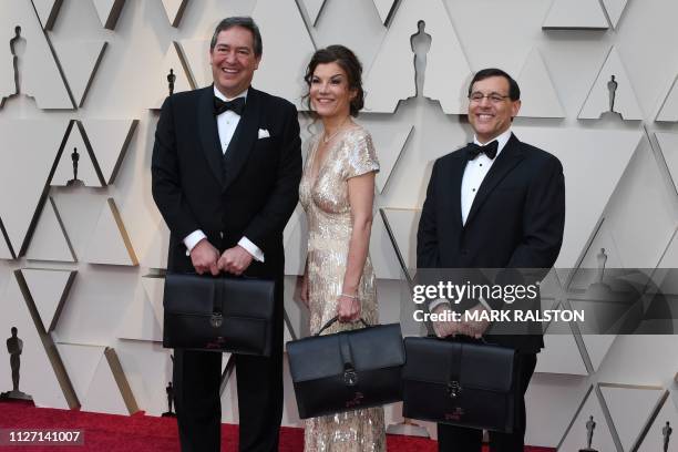 PricewaterhouseCooper representatives carrying the awards envelopes arrive for the 91st Annual Academy Awards at the Dolby Theatre in Hollywood,...