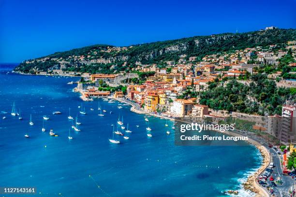 villefranche sur mer and its bay on the french riviera - france beach stock pictures, royalty-free photos & images