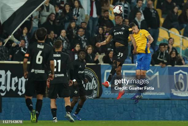 Donald Djousse of AA Coimbra with Filipe Soares of GD Estoril Praia in action during the Ledman Liga Pro match between GD Estoril Praia and AA...