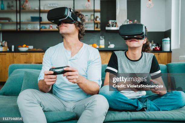 father and son playing with vr - watching parents fight stock pictures, royalty-free photos & images