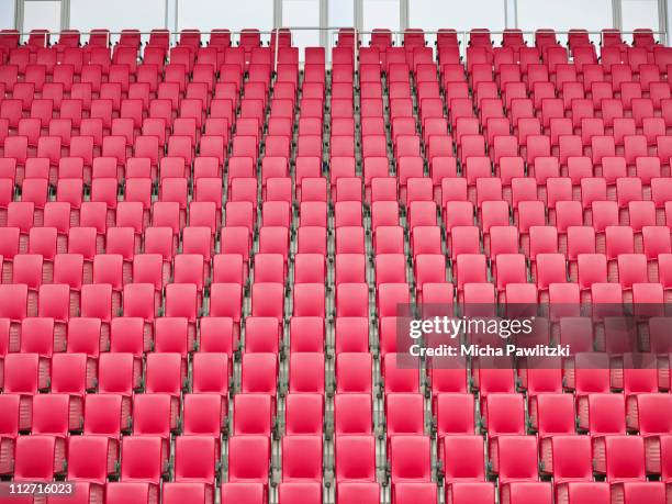 red seats in stadium - stadium seating stock pictures, royalty-free photos & images