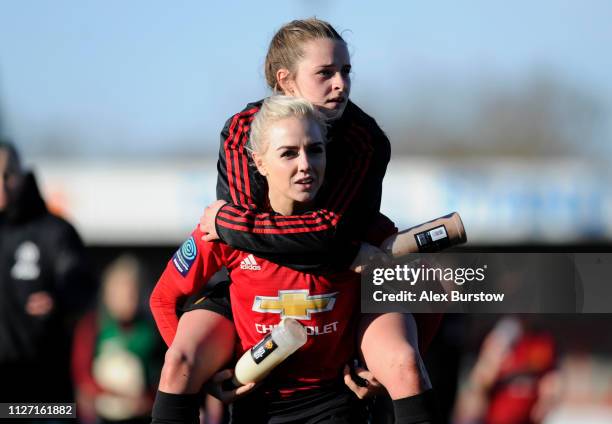 Alex Greenwood and Ella Toone of Manchester United celebrate their team's victory at full-time of the SSE Women's FA Cup Fourth Round match between...