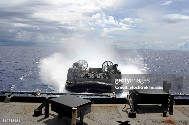 a landing craft air cushion prepares to enter the well-deck of uss harpers ferry. - landing craft transport stock pictures, royalty-free photos & images