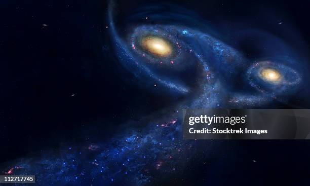 the predicted collision between the andromeda galaxy and the milky way. - spiralgalaxie stock-grafiken, -clipart, -cartoons und -symbole