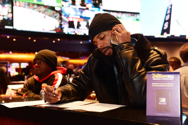 Fans gather at William Hill Sports Book at Ocean Resort Casino to place legalized sports bets on Super Bowl Sunday for the first time ever on...