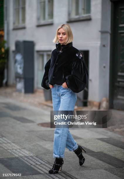 Lisa Hahnbueck is seen wearing black cropped Moncler jacket, denim jeans Goldsign, Jimmy Choo shoes during the Copenhagen Fashion Week Autumn/Winter...